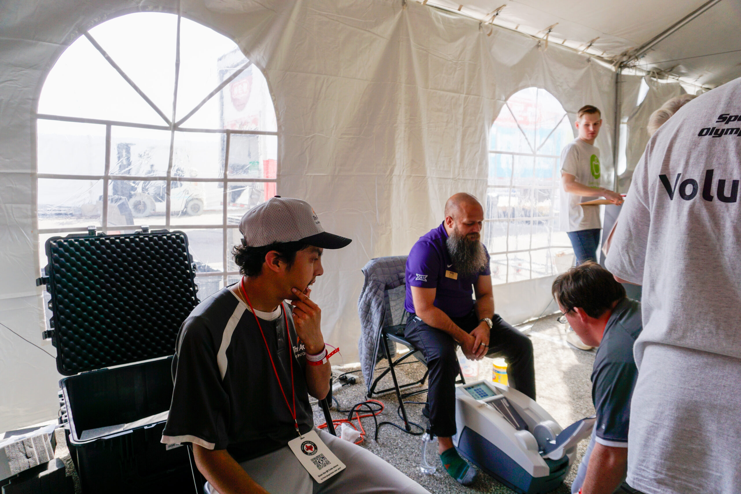 Special Olympic athlete getting a health screen provided by tcu student